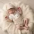 Zyzio & Zuzia kisfiú 4 részes muszlin baba együttes bodyval, kantáros rövidnadrággal, sapkával és csokornyakkendővel homokbézs 62