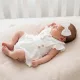 Zyzio & Zuzia kislány 3 részes muszlin baba szett bodyval, vállpántos szoknyával és hajpánttal fehér 68